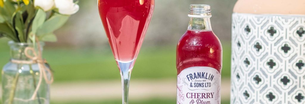 Cherry and plum soft drink mimosa cocktail
