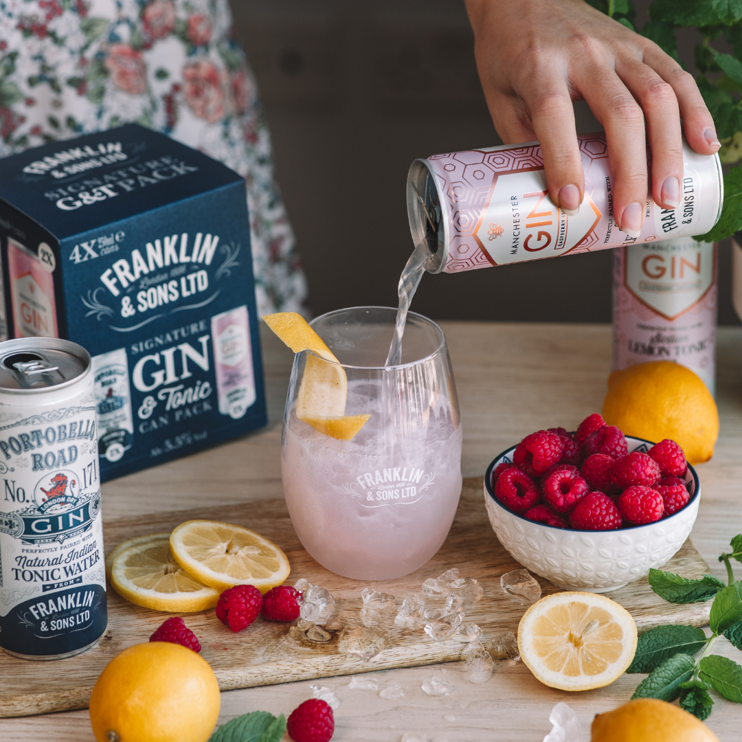 Pouring the Manchester Gin Raspberry Infused Gin and Franklin & Sons Sicilian Tonic Water can from our can pack