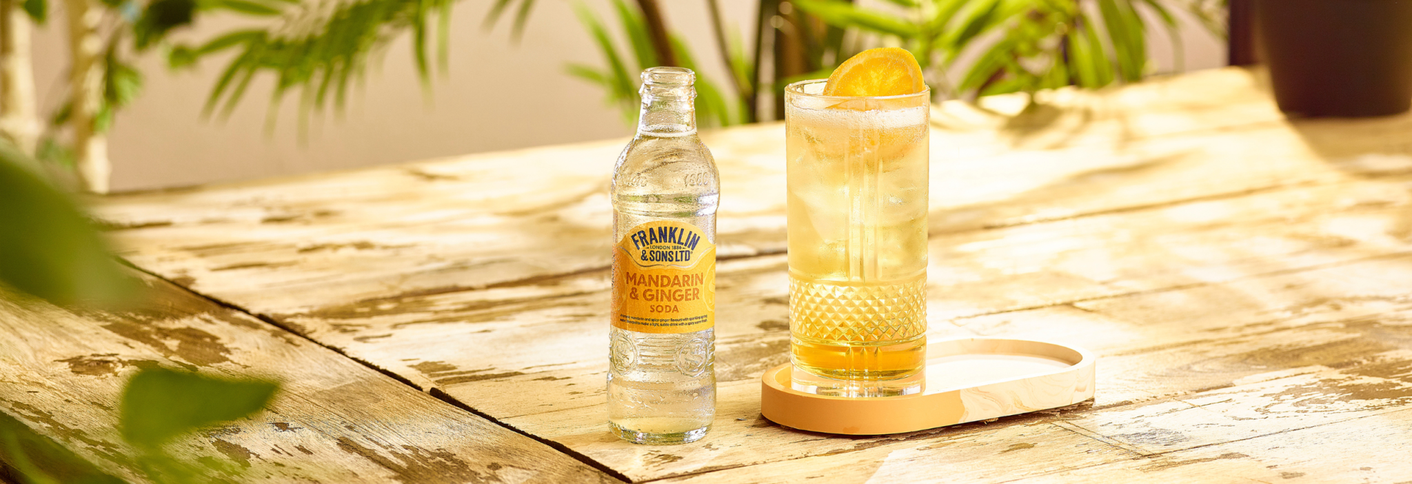 Scotch and mandarin cocktail next to Franklin & Sons Mandarin & Ginger Soda | Franklin & Sons